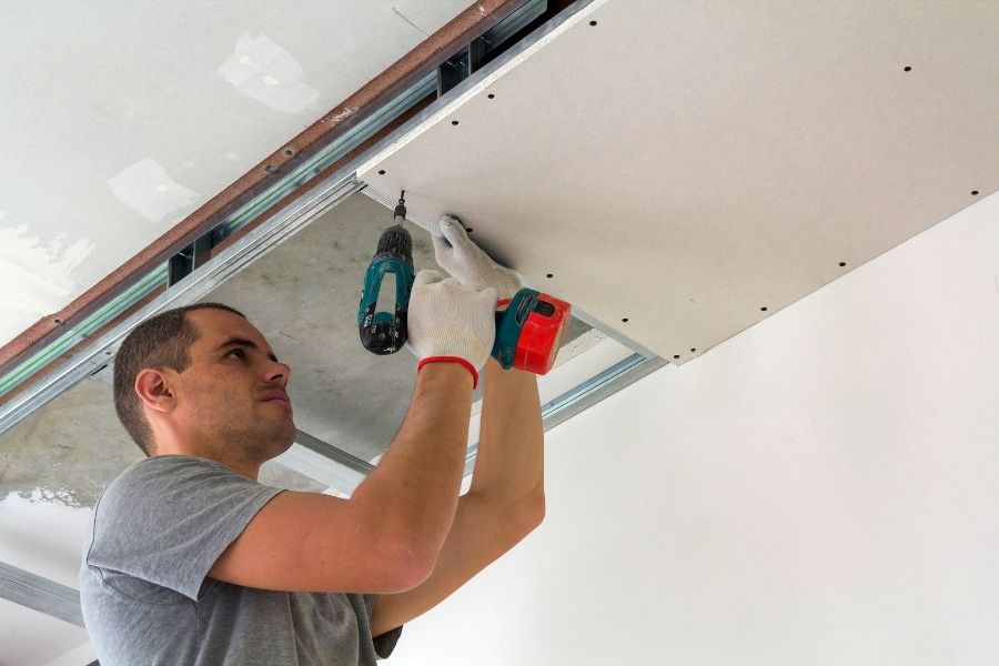 Water damaged ceiling being repaired and replaced
