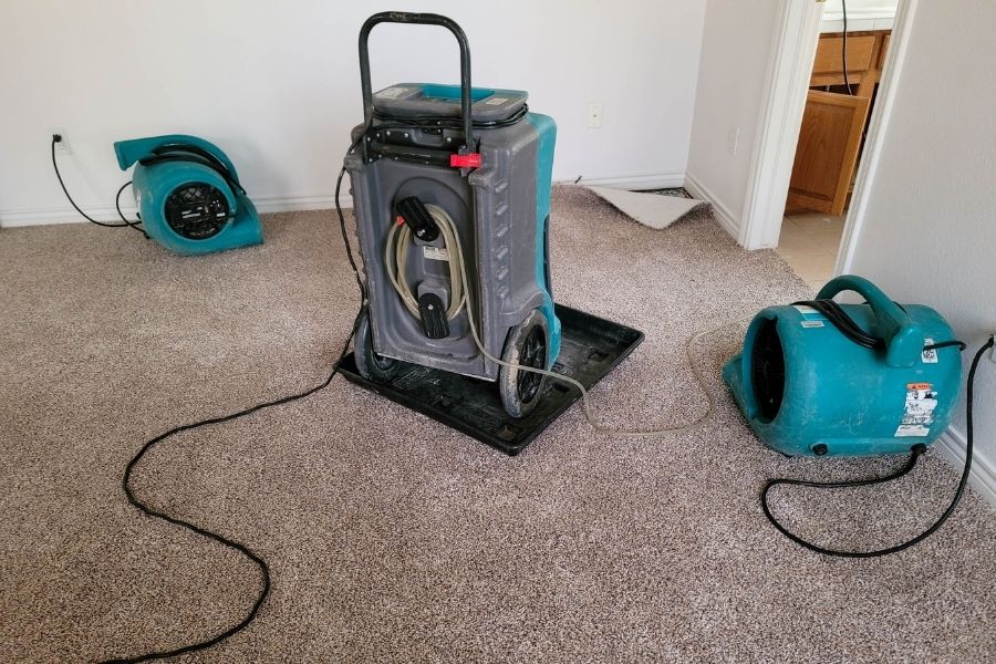 Professional water damage drying equipment including dehumidifiers and air movers