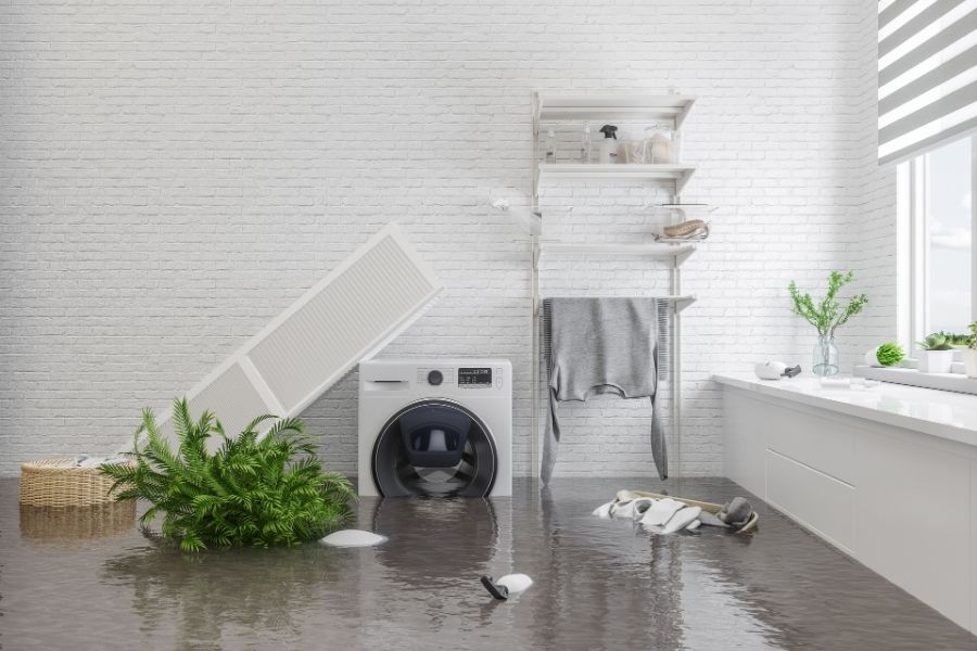 Washing machine water damage flooding laundry room