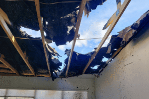 Holes in roof after a fire damage