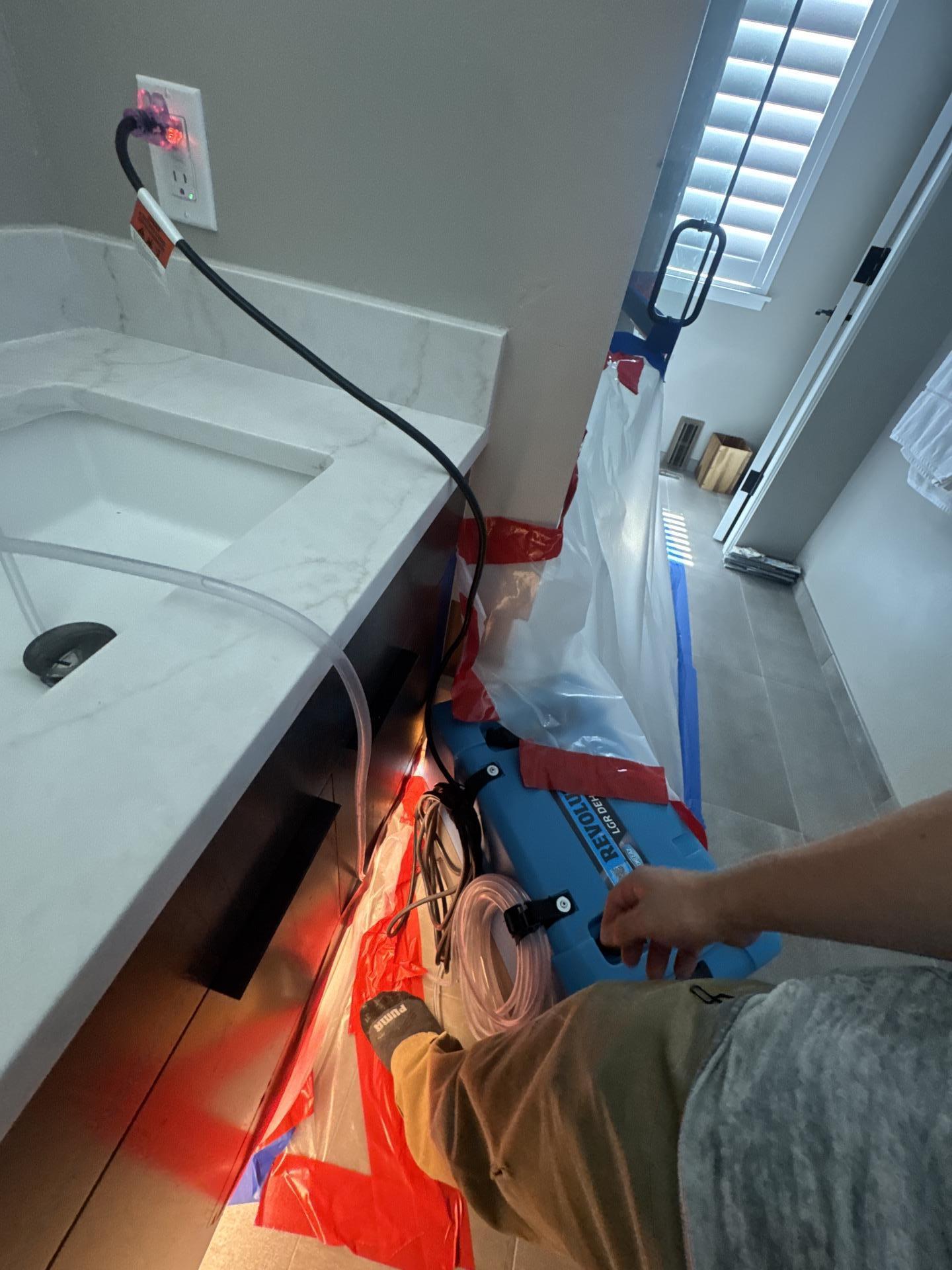 Bathroom water damage restoration in progress