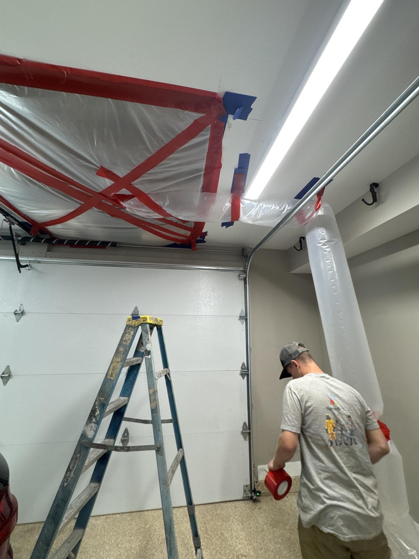 Water damage assessment showing affected ceiling