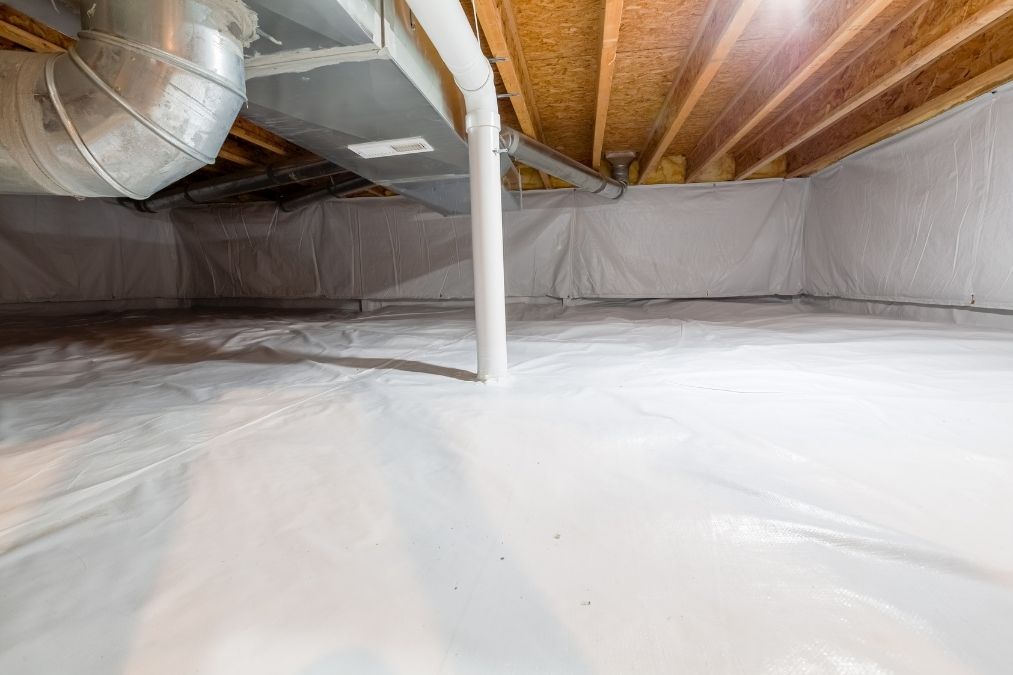 Professional crawl space encapsulation with vapor barrier installation