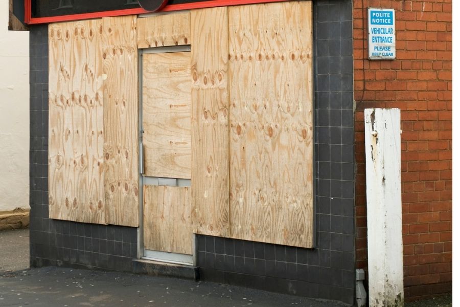 Board-up services protecting a fire-damaged home
