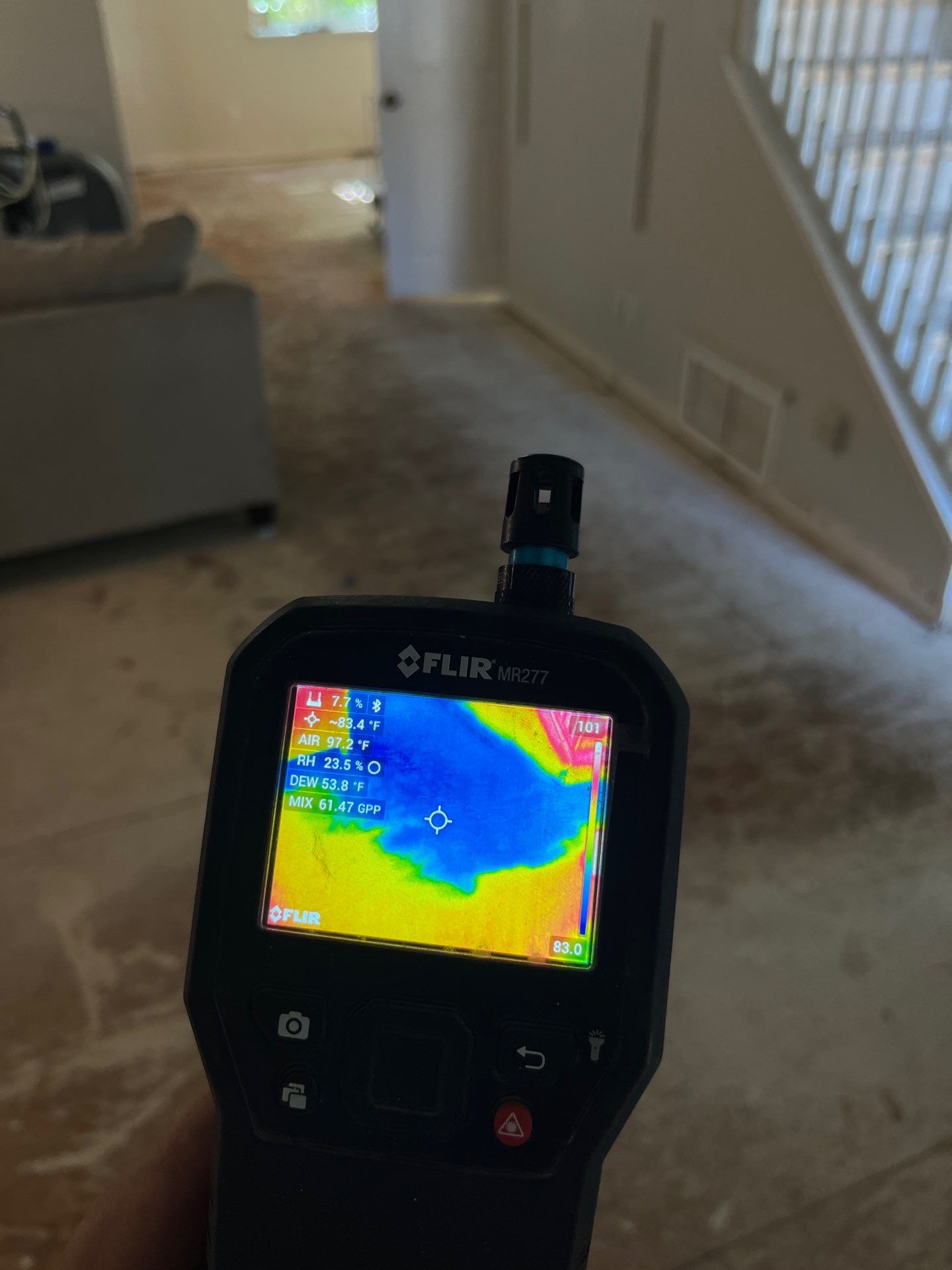 Moisture meter readings during water damage inspection