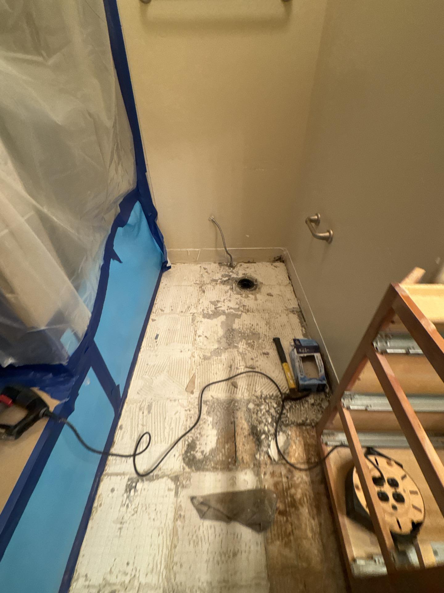 Bathroom mold remediation in progress with containment barriers established