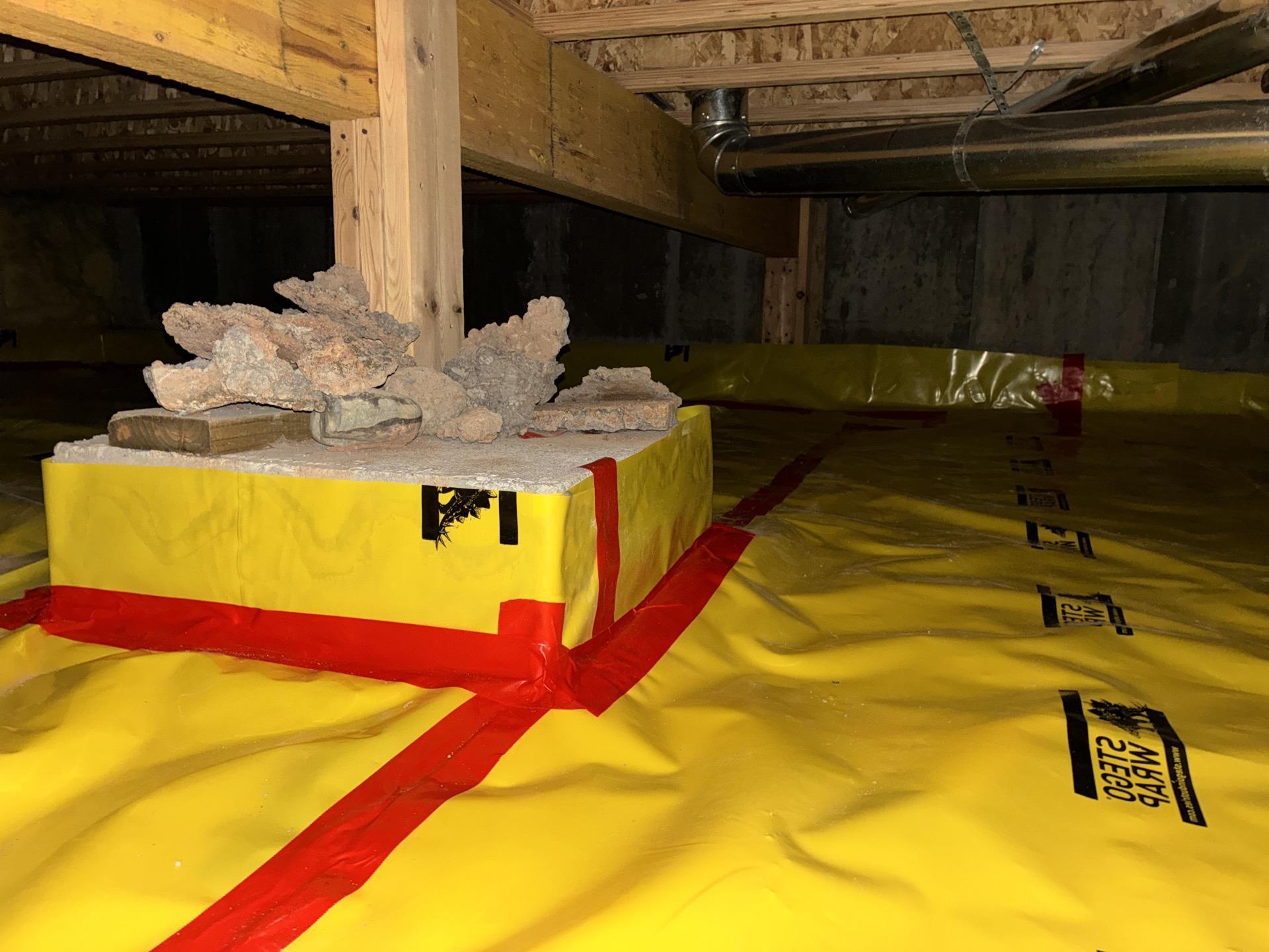 New 10-mil Visqueen vapor barrier installed in crawlspace with proper overlap and sealing