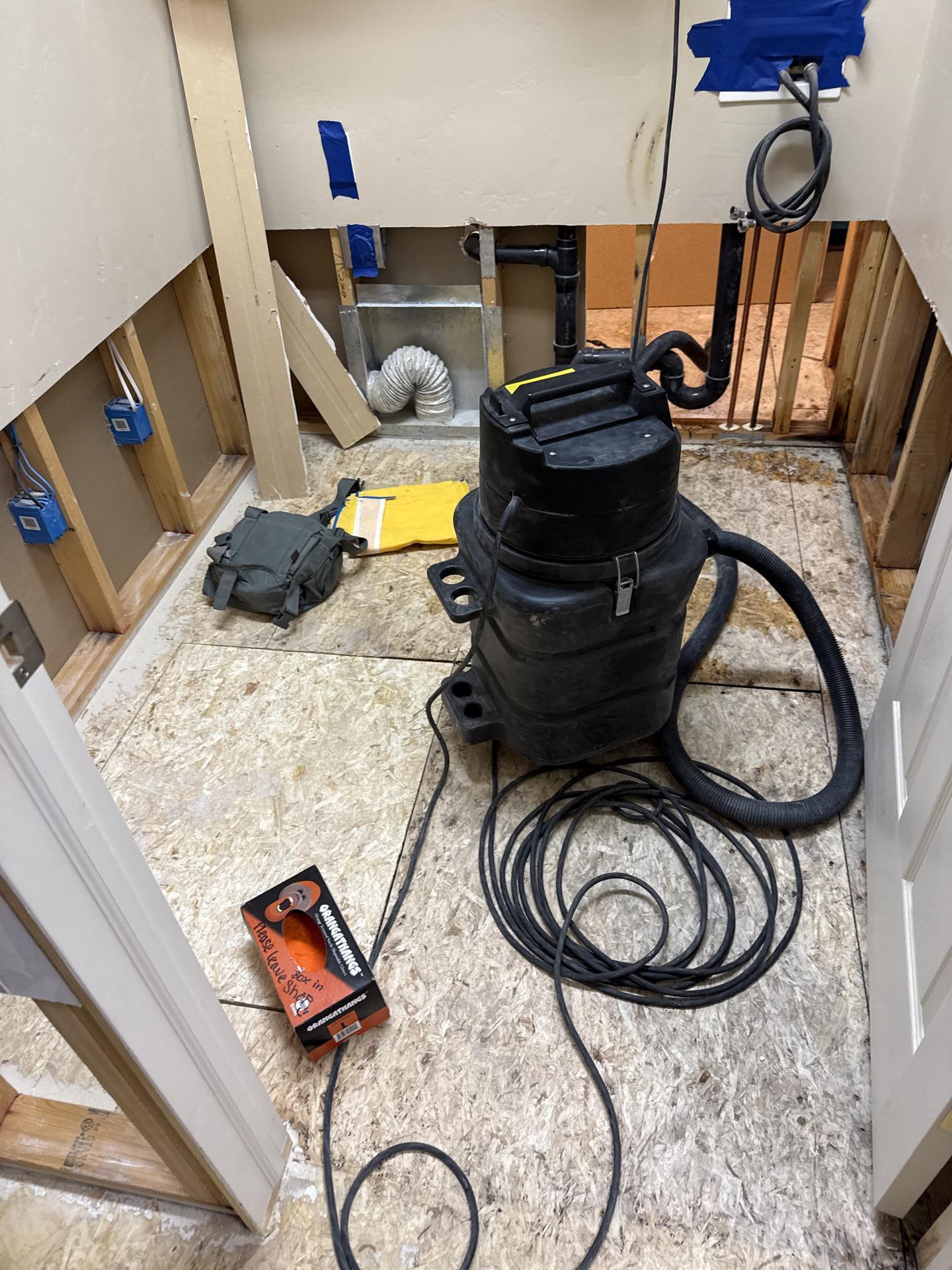 Laundry room mold removal completed showing treated structural materials post-remediation