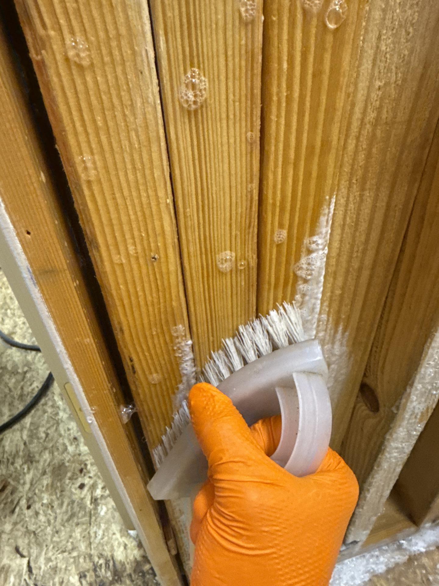 HEPA vacuuming and antimicrobial treatment applied to exposed structural materials
