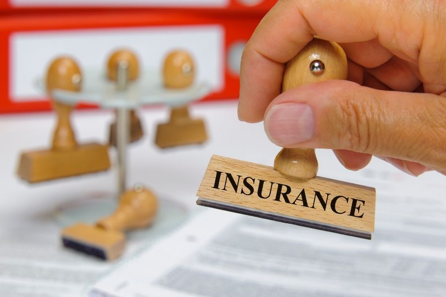 Home insurance claim approval stamp on policy document
