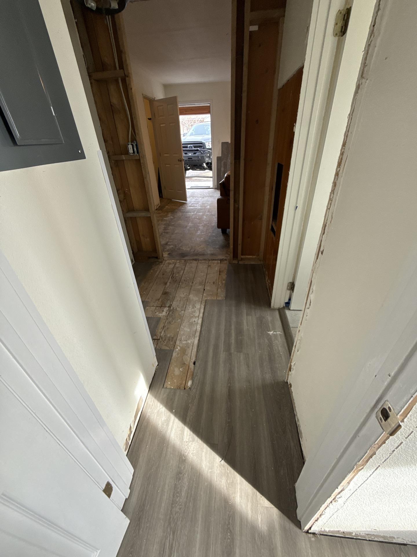 Hallway after water damage restoration completed with walls dried and all equipment removed