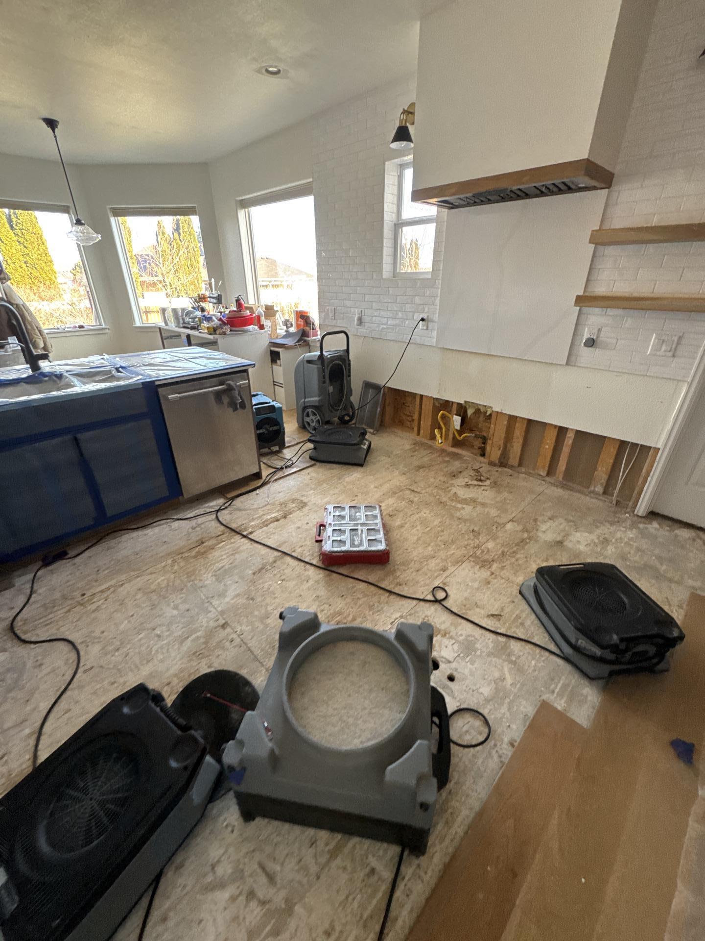 Cleared kitchen area dried back to standard after water mitigation