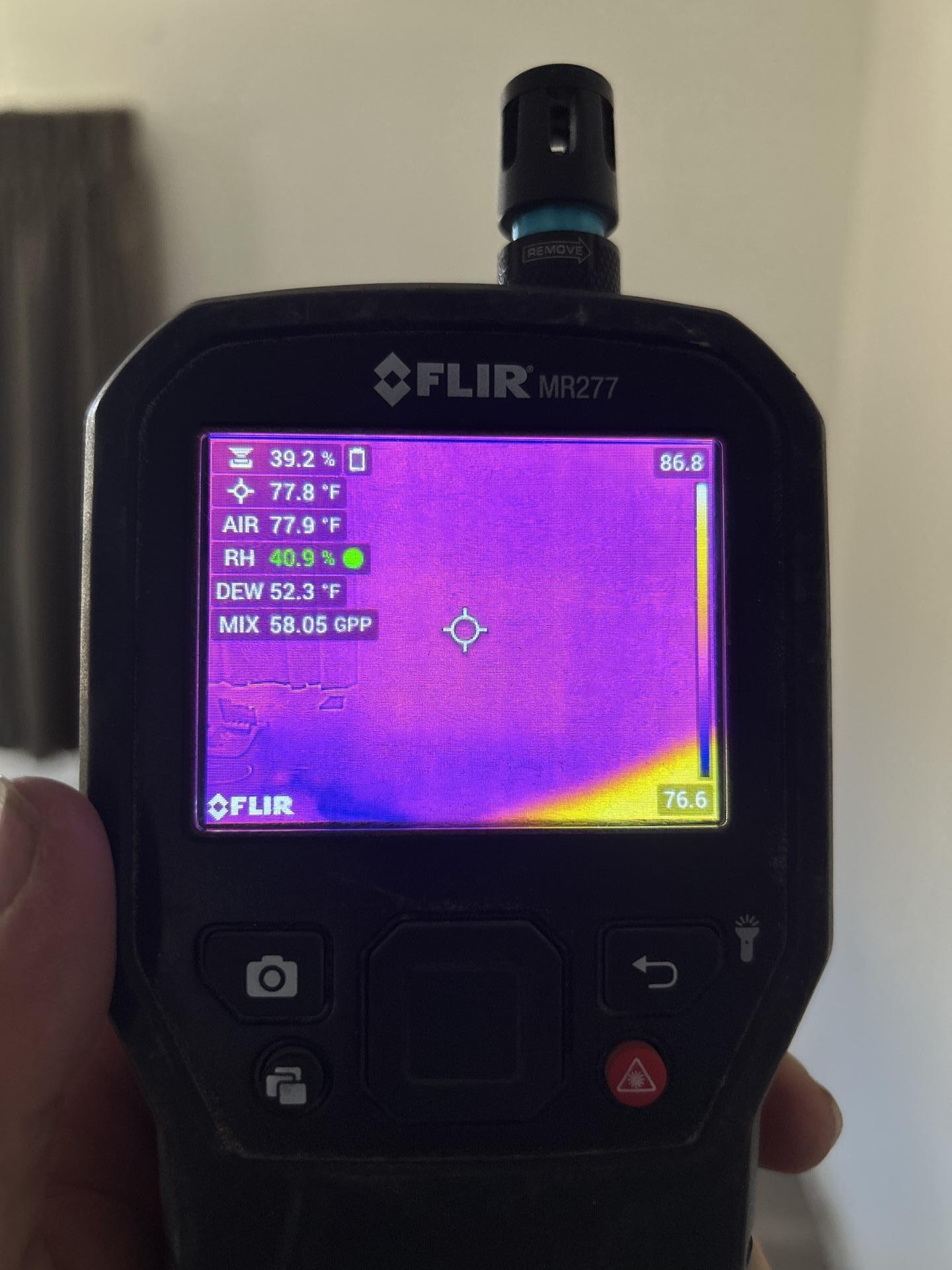 Thermal imaging scan revealing hidden water damage inside walls during Meeker water loss assessment