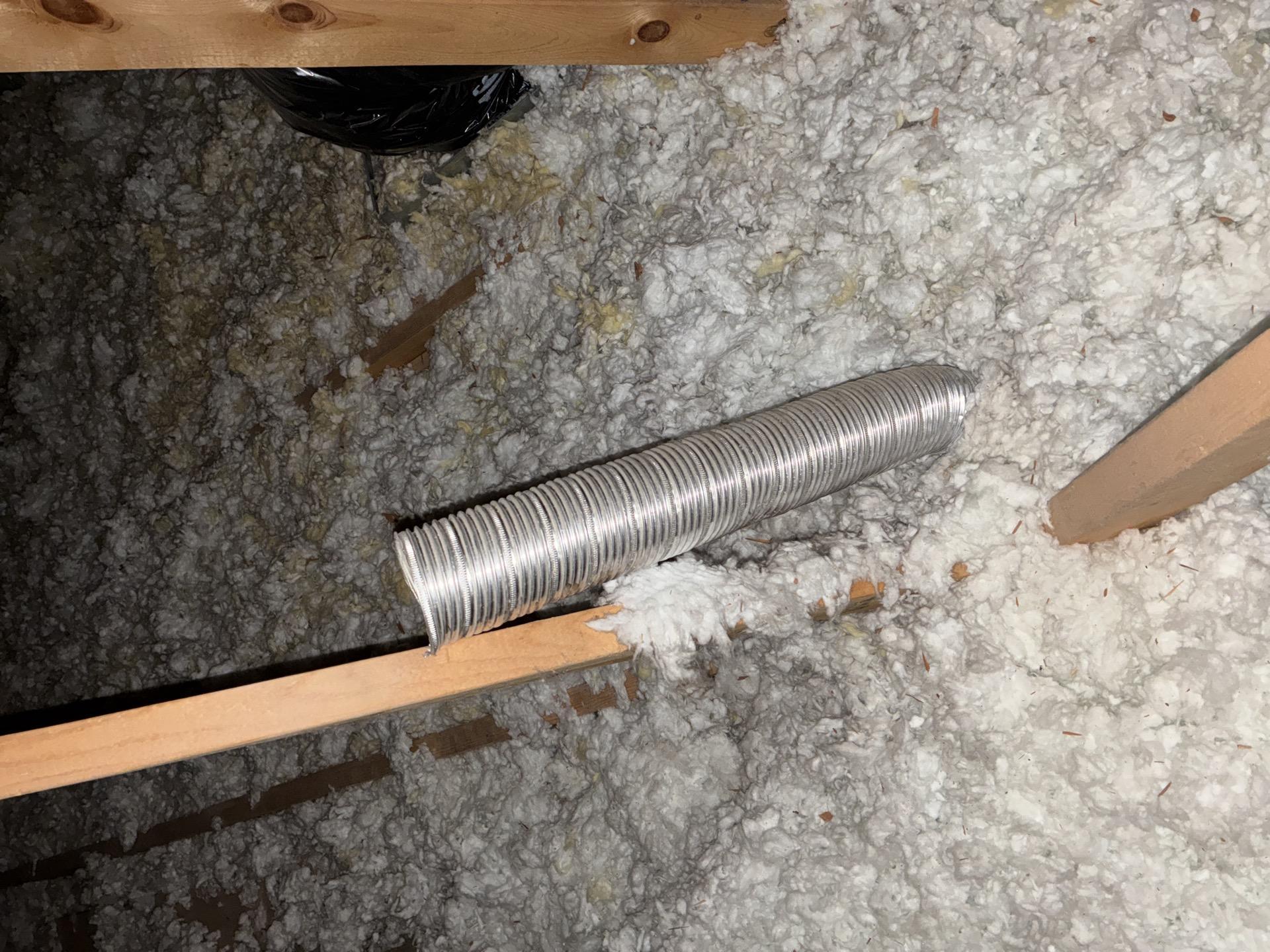 Water damaged attic insulation with visible mold growth in a Parachute CO home