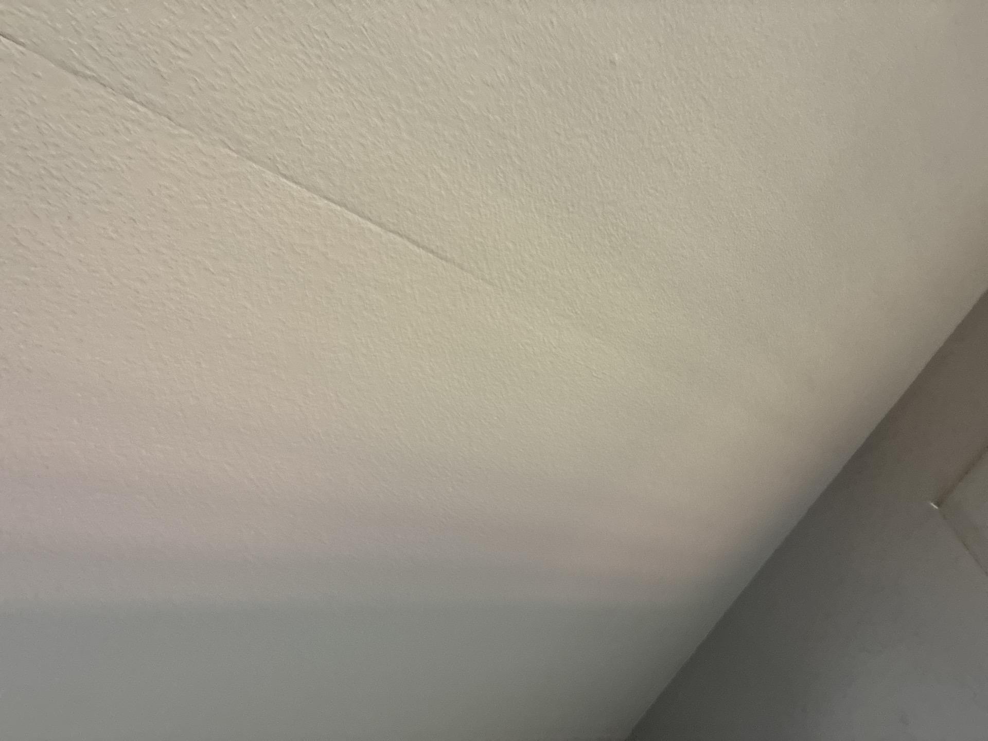 Water stained ceiling drywall damage in a Parachute Colorado living room